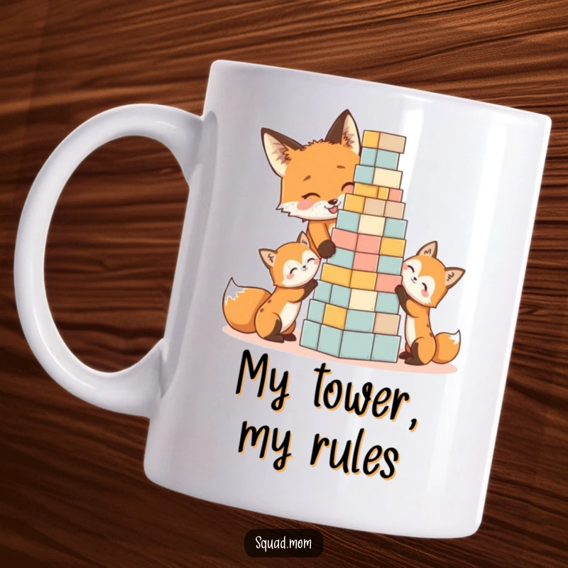 Funny fox mom and kits laughing while building a colorful block tower, perfect for a humorous gift mug.