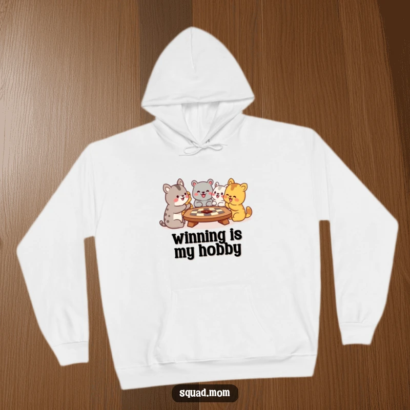 Funny hoodie depicting a group of animal friends joyfully engaging in a board game, radiating warmth and comical excitement, ideal for cozy laughs.