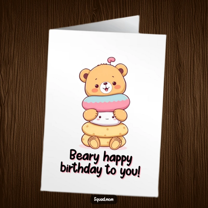 Funny Free Printable Birthday card with a cheerful bear cub balancing a tall stack of colorful soft toys.